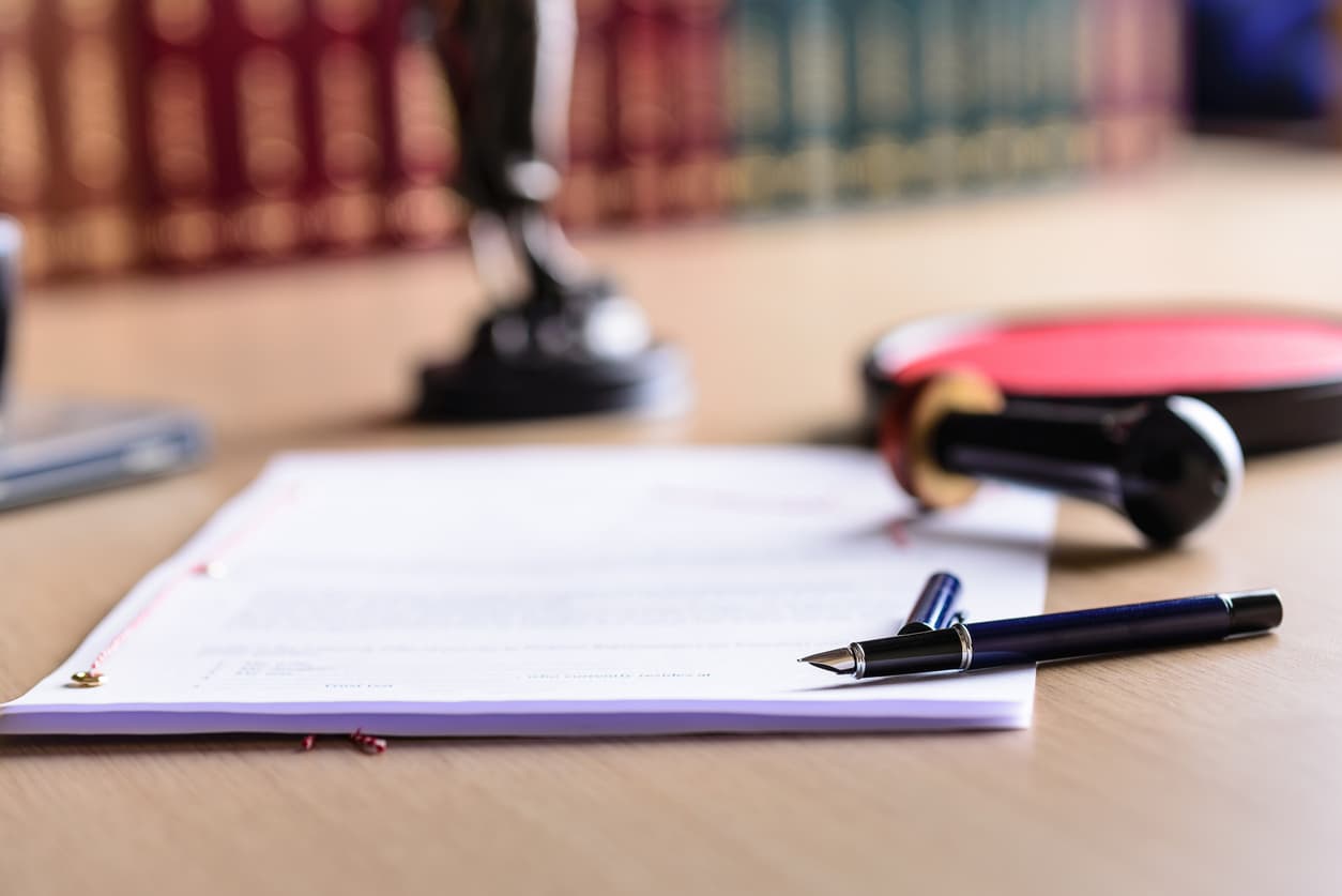 Close-up of certified document with fountain pen and notary seal on desk, symbolizing legal authentication services by NotaryPublic24.com.
