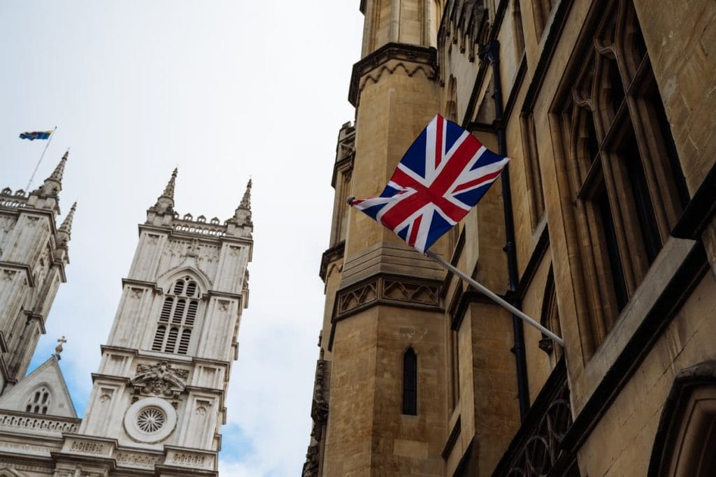 Common Questions About UK Apostille Certificates 6 Union Jack flag on historic UK government building, representing the official process of apostille certification in the United Kingdom.