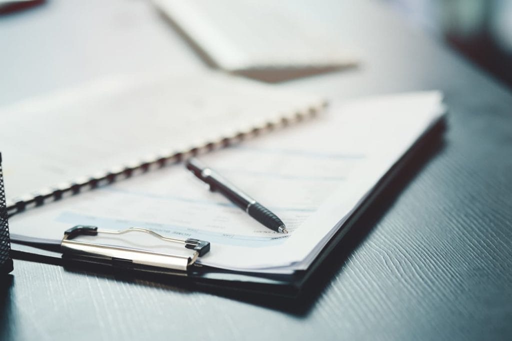 Documents titled Articles of Association with a pen on a clipboard, symbolizing legal paperwork required for company registration, international business, or official notarization and apostille — as explained in the blog “Everything You Need to Know About Articles of Association” on notarypublic24.com.