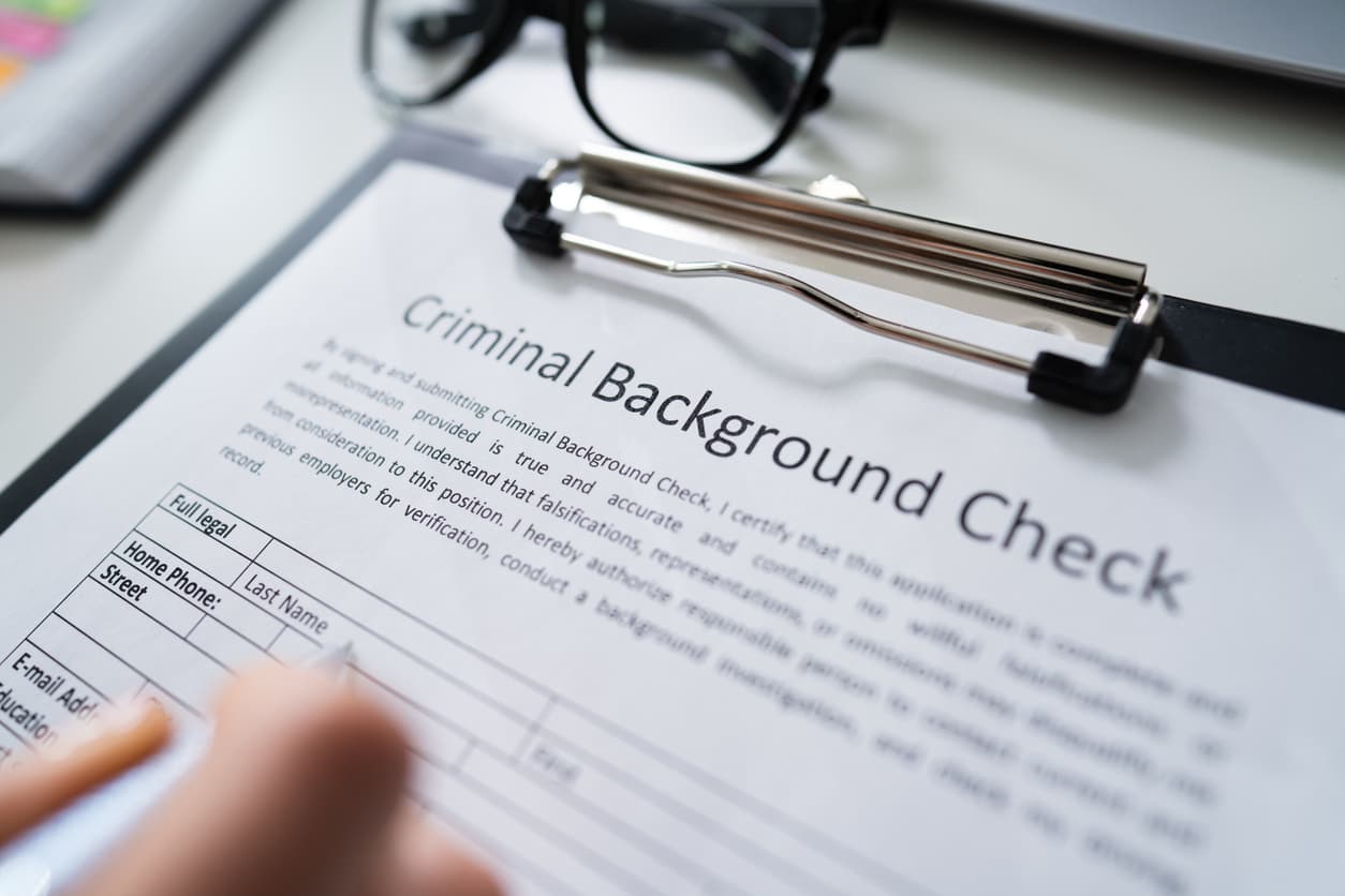 Criminal background check form being filled out, used for notarization and Apostille certification at notarypublic24