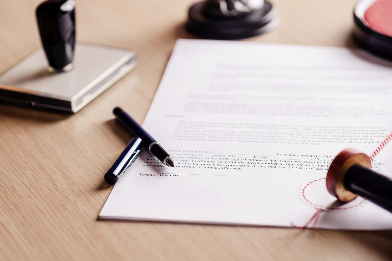 Signed legal document with fountain pen, wax seal and notary stamp – symbolizing UK grant of probate notarization and Apostille for international legal use