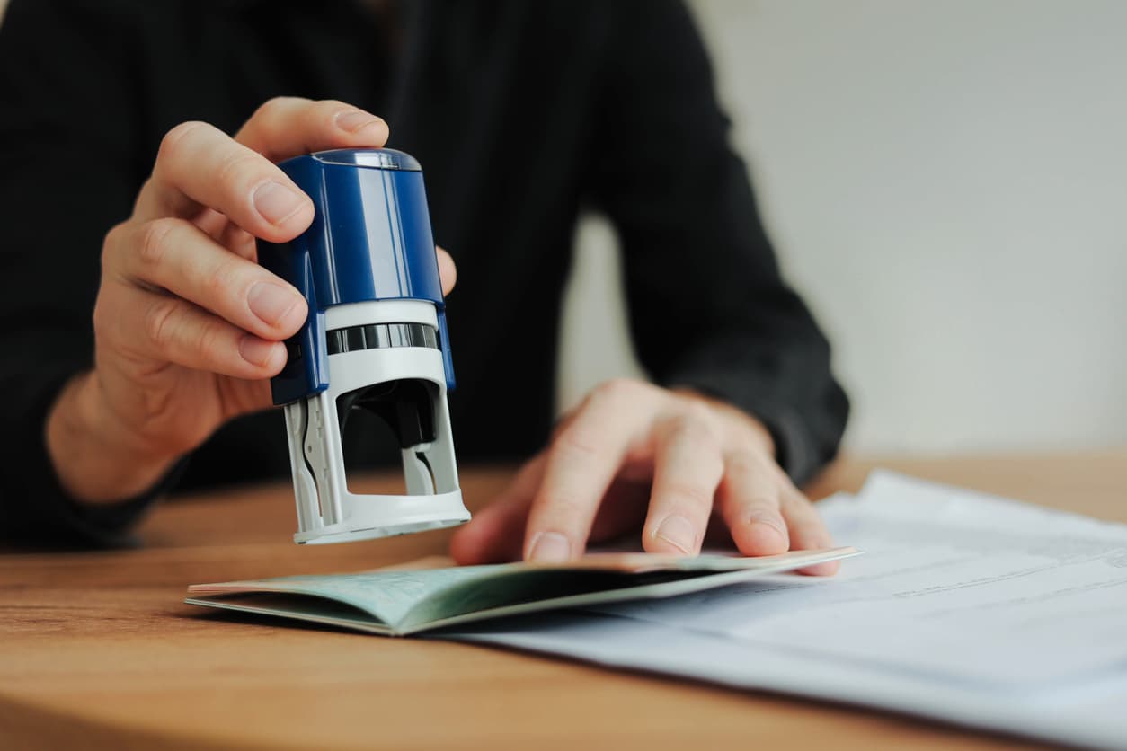 Person stamping an affidavit of support document for visa or immigration – legal verification and notarization by NotaryPublic24.