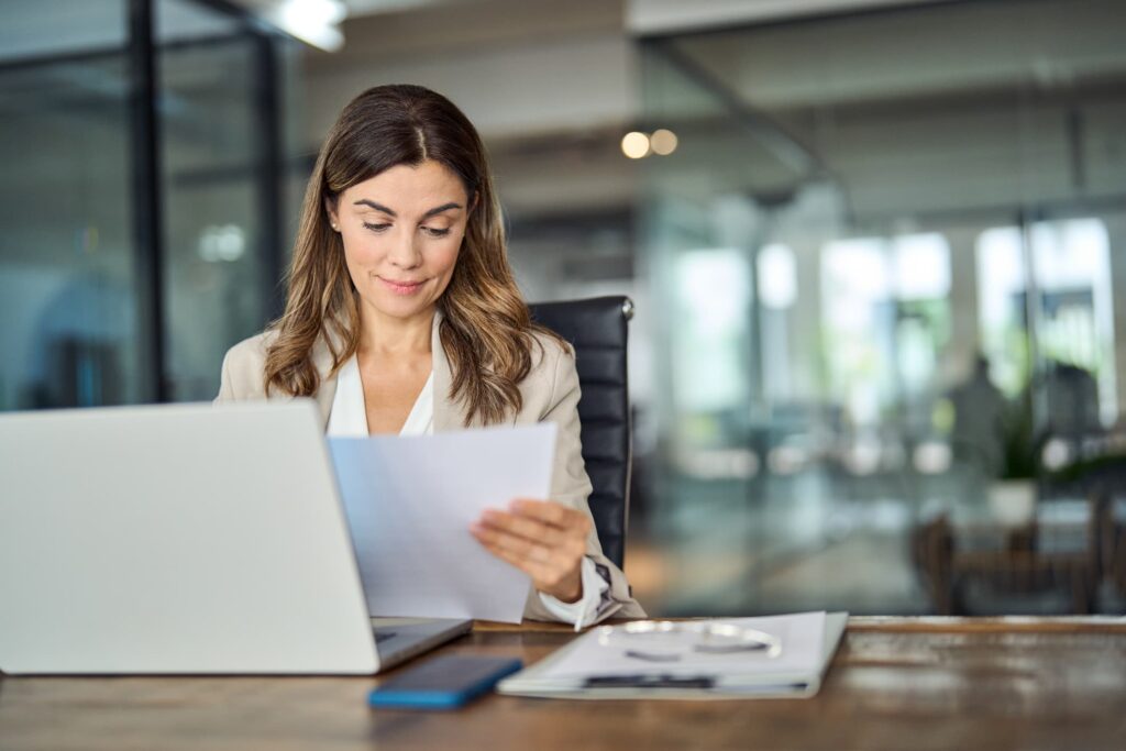 Business professional reviewing legal documents to establish a business power of attorney – secure company authorization and legal protection with NotaryPublic24.
